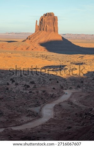 Dramatic view of the Monument Valley's magnificent butte and mittens lit up during a sunset.
Iconic butte, spire and mitten formations used as a backdrop in many old western movies.
