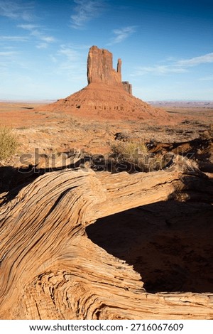 Dramatic view of the Monument Valley's magnificent butte and mittens lit up during a sunset.
Iconic butte, spire and mitten formations used as a backdrop in many old western movies.
