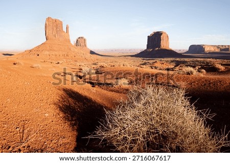 Dramatic view of the Monument Valley's magnificent butte and mittens lit up during a sunset.
Iconic butte, spire and mitten formations used as a backdrop in many old western movies.
