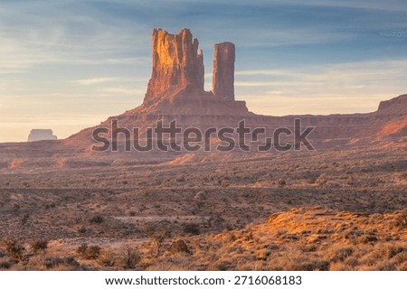 Dramatic view of the Monument Valley's magnificent butte and mittens lit up during a sunset.
Iconic butte, spire and mitten formations used as a backdrop in many old western movies. Navajo, Arizona, USA