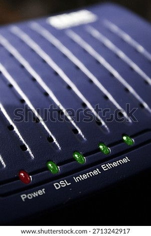 Dramatic view of an old ADSL modem. In blue, low key photography