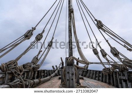 Dramatic View of Old Viking Longship Deck and Ropes, Symbolizing Adventure, Exploration, and the Concept of Taking a Journey or Challenge.