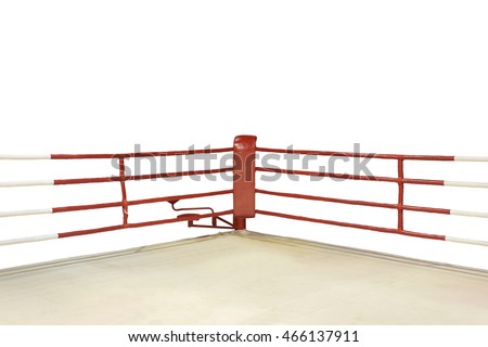 A dramatic view of the red corner of a regular boxing ring surrounded by ropes spotlit by a spotlight on an isolated white background. This has clipping path.
