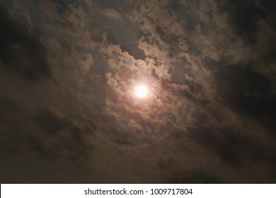 dramatic view of Sun is hiding under dark cloud