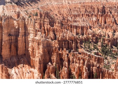 Dramatic view of sunlit geological formations in a canyon, evoking awe and ancient beauty