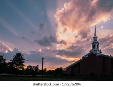 Dramatic View Of Sunset Sky Over Midwestern Church 