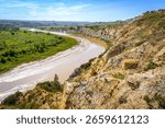 A dramatic view from Wind Canyon at Theodore Roosevelt National Park overlooks the winding Little Missouri River