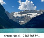 Dramatic Views of Canoers and Mountains on Lake Louise