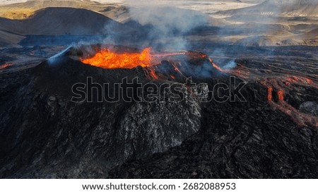 Dramatic volcanic landscape with vibrant red lava flows and textured black rock formations.