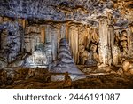 Dramatic wall with multiple stalactites in cave in the large underground limestone Cango Caves near Oudtshoorn, Western Cape South Africa