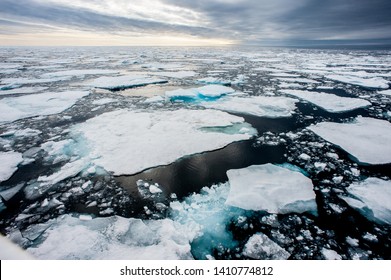 Dramatic wide angle view of melting  arctic sea ice floes breaking up taken at sea.Climate Crisis and Breakdown.Climate Emergency- Image