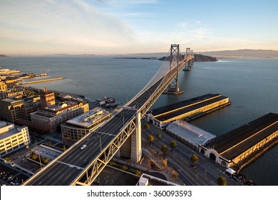 Dramatic wide-angle aerial view above the San-Francisco Oakland Bay Bridge on a brilliant winter morning