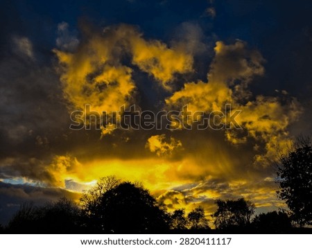 Dramatic yellow sundown on a summer evening
