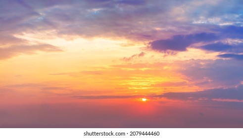 Dramaticl  sunrise sundown sky background with gentle colorful clouds without birds. Panoramic