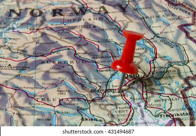 Drammen Marked With Red Pushpin On Map. Selected Focus On Drammen And Bright Red Puspin. Pushpin Is In An Angle. Southern Parts Of Norway Can Be Seen On Map.