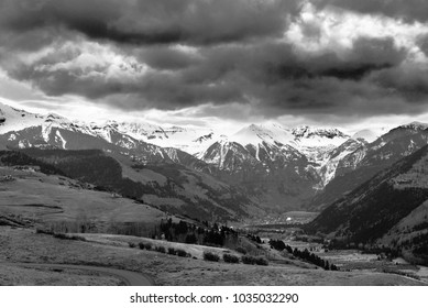 Dramtic Sky Sunrise With Storm Over Snowcapped Mountains In Black And White, Telluride, Colorado, USA