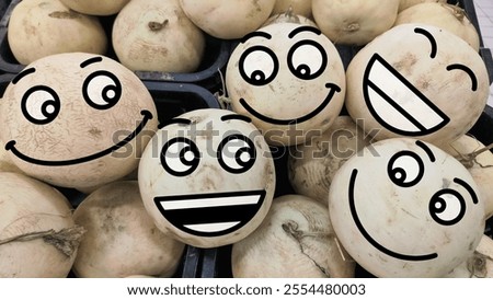 draw a face on the fruit of a group of laughing emojis or like each other. the concept of joy. expressions and funny faces