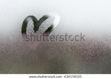 Draw the heart on vapor at the glass