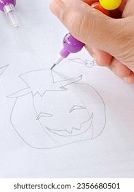 Draw pumpkin shape and pencil white paper 