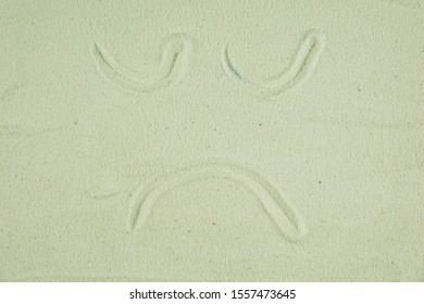 Draw Sand In The Picture Of Sad Face