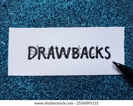 Drawbacks writting on blue background.