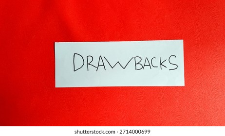 Drawbacks writting on a red background