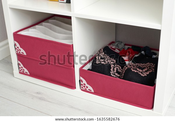 The drawer is divided into cells of different\
sizes, for separate storage of linen and fabrics. Home storage\
system for storing clothes. Folding boxes in a set have different\
shapes.