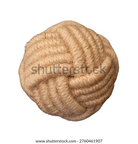 Drawer pull handle wrapped in natural beige rope Monkey fist knot made of brown jute rope isolated on white background. Decorative twine ball for maritime decor, marine knot tying