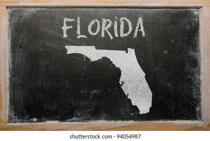 drawing of american state of florida on chalkboard, drawn by chalk