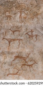 Drawing In The Cave With Ocher Paints, A Wall Of Rock. God, Leader, Shaman, Observe The Hunting Of An Ancient Man On Animals. Prehistoric, Primitive, Neanderthal,, Cave Man. Anthropology