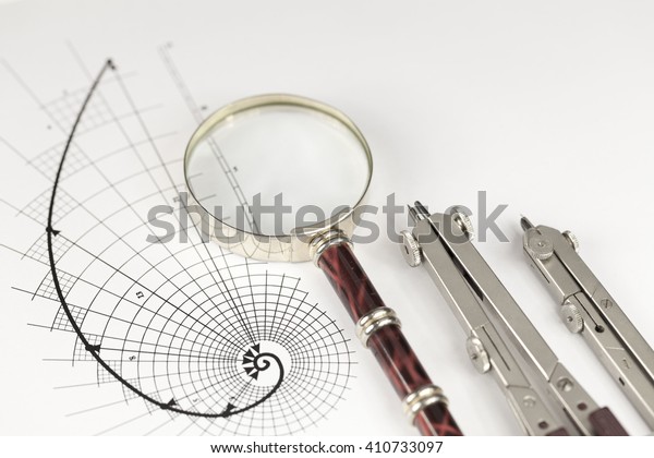 drawing of the golden section, magnifying glass\
& compass
