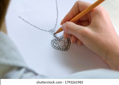 Drawing Jewelry Design. Drawing sketch jewelry on paper . Design Studio. Creativity Ideas. - Powered by Shutterstock