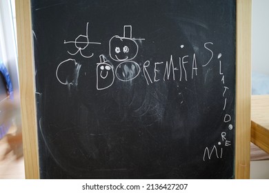 Kids’ Drawing On A Blackboard