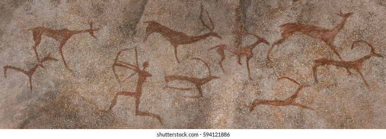 drawing on the wall in a cave, the rock. red ocher paint. Prehistoric man preys on animals deer. neanderthal, primitive, caveman, stone age, ice age.