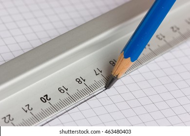 Drawing Straight Line With Pencil And Ruler In Exercise Book