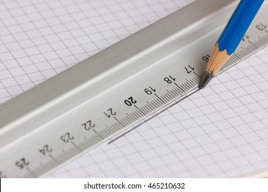 Drawing Straight Line With Pencil And Ruler In Exercise Book