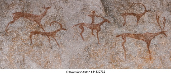 Drawings in cave the wall  painted and ocher rock  Primitive man  primitive Neanderthal  The hunter hunts deer  Stone Age  Ice Age  Caveman 