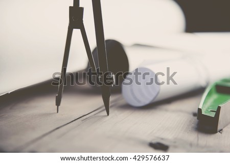 drawings and stationery on wooden table
