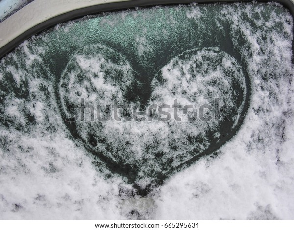  Drawn heart on frosted car window                      \
       