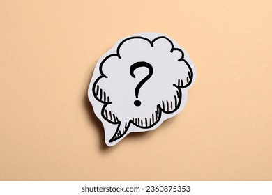 drawn question mark on a beige background