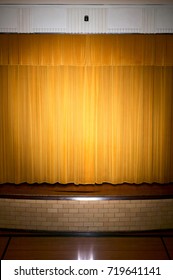 Drawn Retro Style Curtains On A Performance Stage Lit By Spotlight With No People.