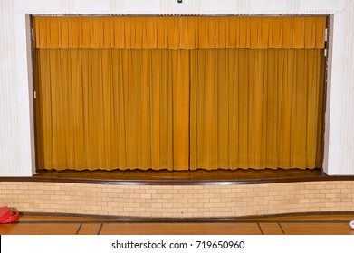 Drawn Retro Style Curtains On Small School Assembly Stage With No People.