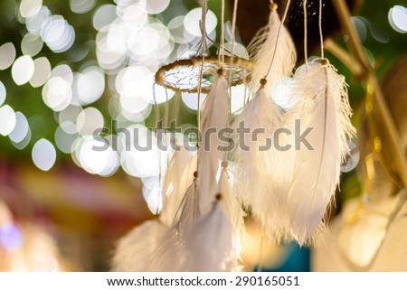 dream catcher with bokeh lights background at night