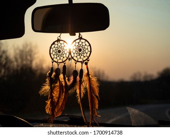 Dream catcher hanging in car at sunlight background - Powered by Shutterstock