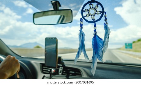 Dream Catcher Hanging Inside Car On A Back View Mirror.