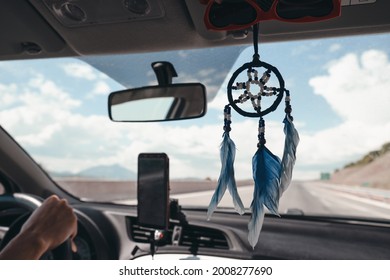 Dream Catcher Hanging Inside Car On A Back View Mirror.