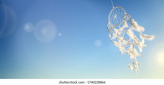 Dream catcher on blue sky sunset background with copy space