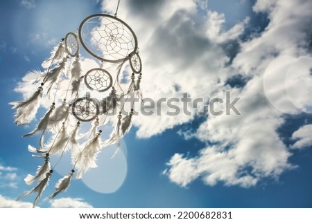 Dream catcher on blue sky and cloud background with copy space