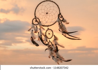 Dream Catcher on the sunset background

 - Shutterstock ID 1148207342