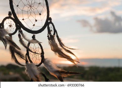 Dream Catcher on the sunset background - Shutterstock ID 693330766